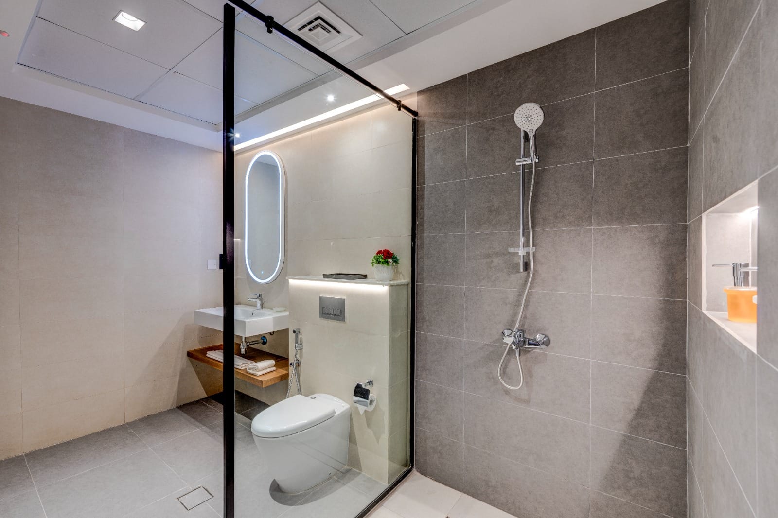 Compact bathroom with glass shower screen