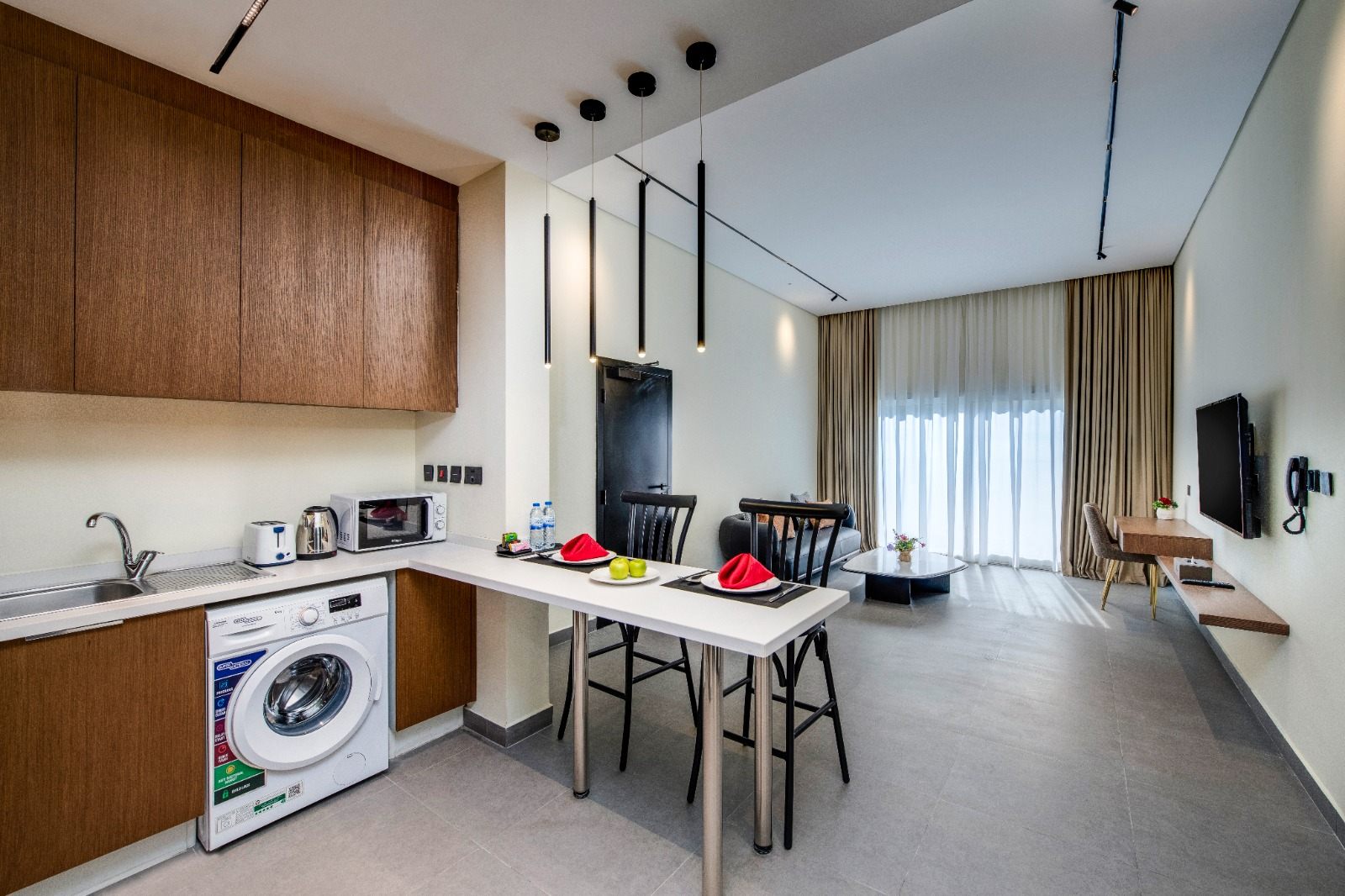 Studio-style living, dining and kitchen with breakfast bar